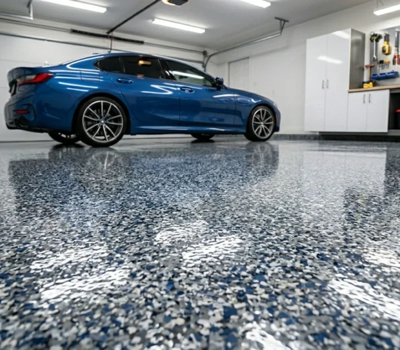 1-day garage floor installation Tampa featuring blue decorative flakes